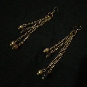 Dangling gold earrings